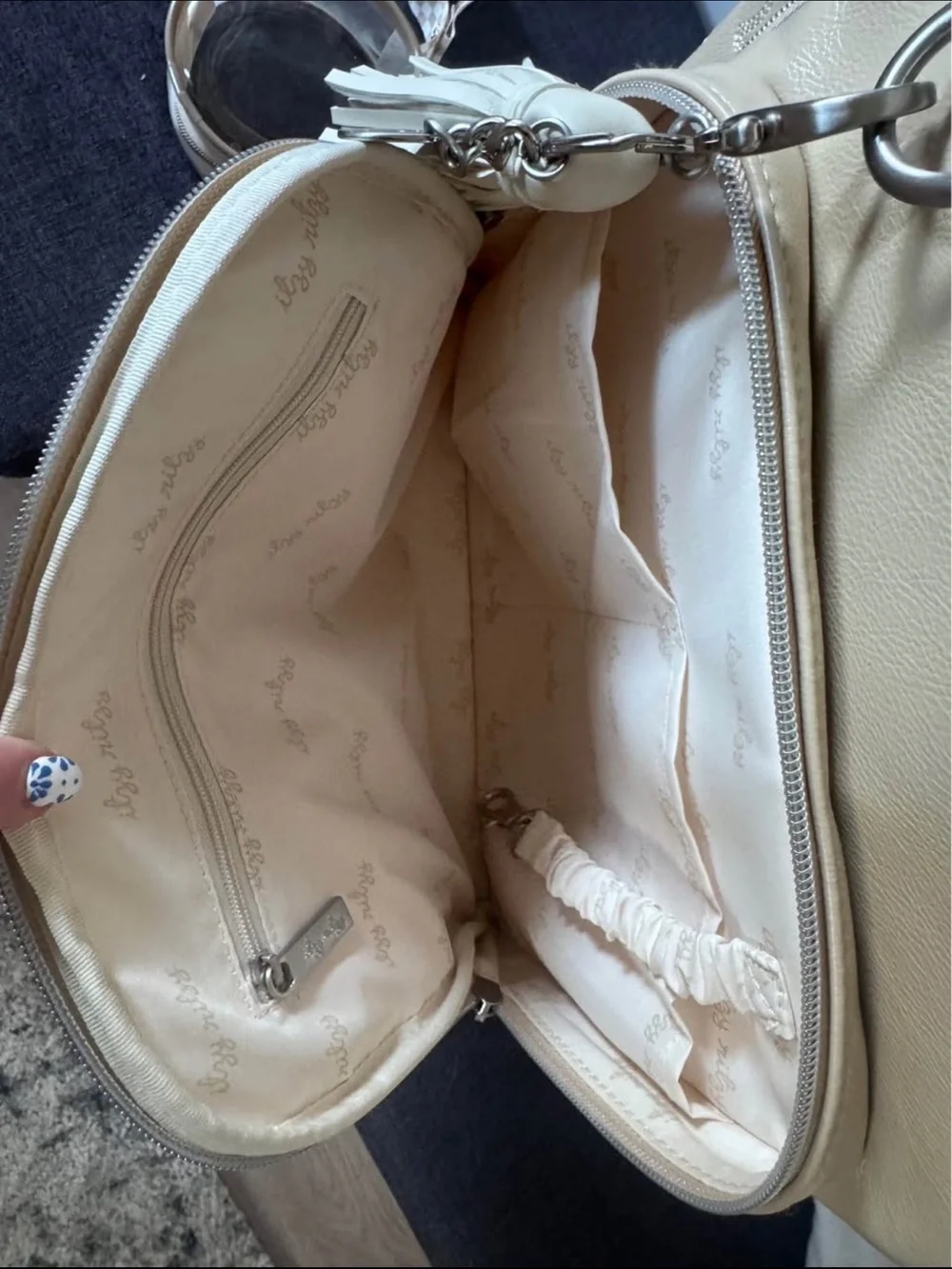 Itzy Ritzy Beige Cream Baby Bag Backpack with Tassel Charm